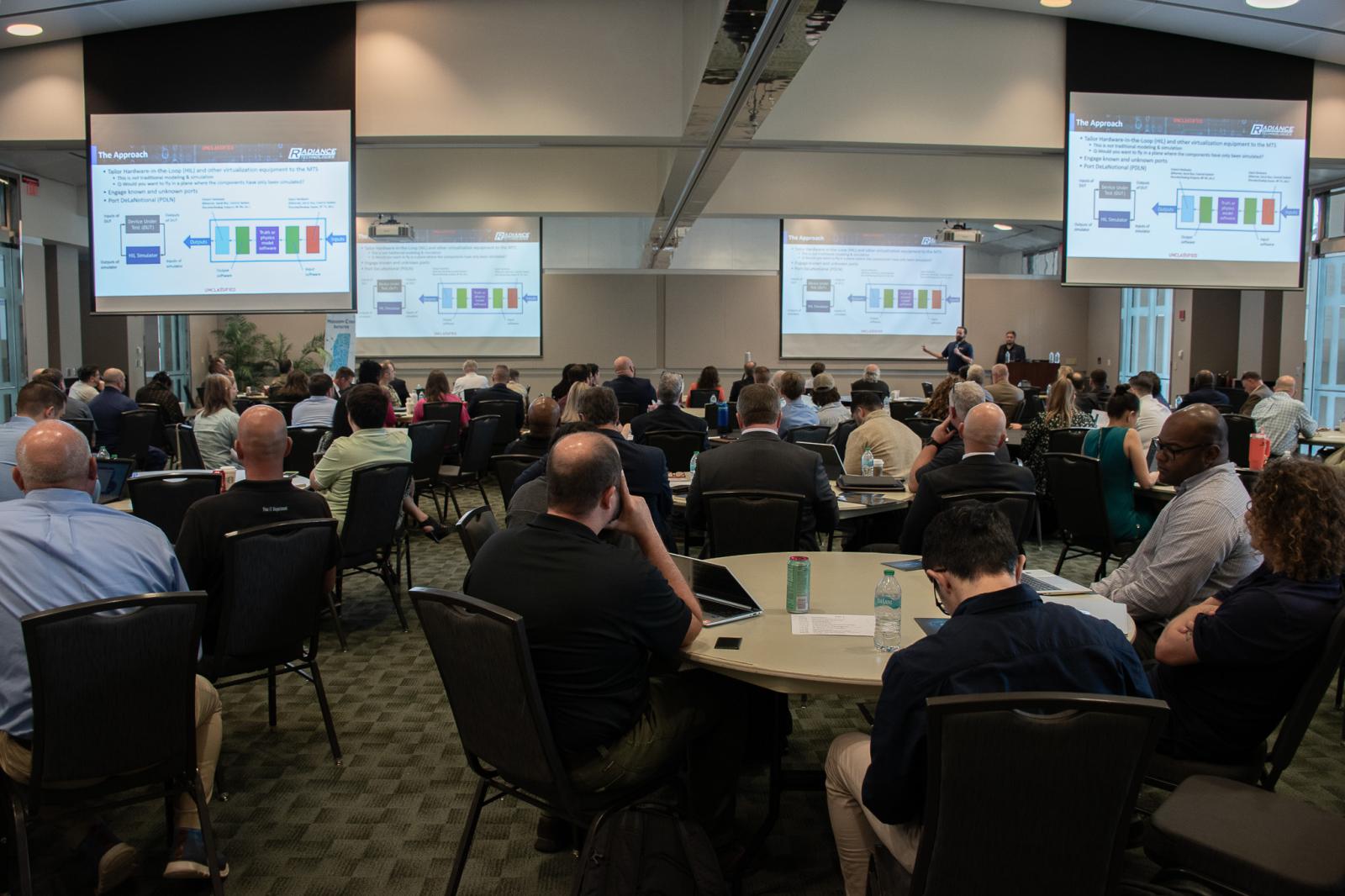Attendees listen during a presentation at the MCI Cyber Tabletop Exercise